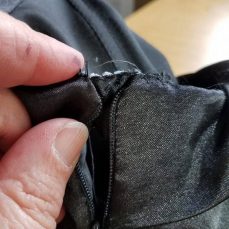 pinning in the sleeve to the top of the zipper